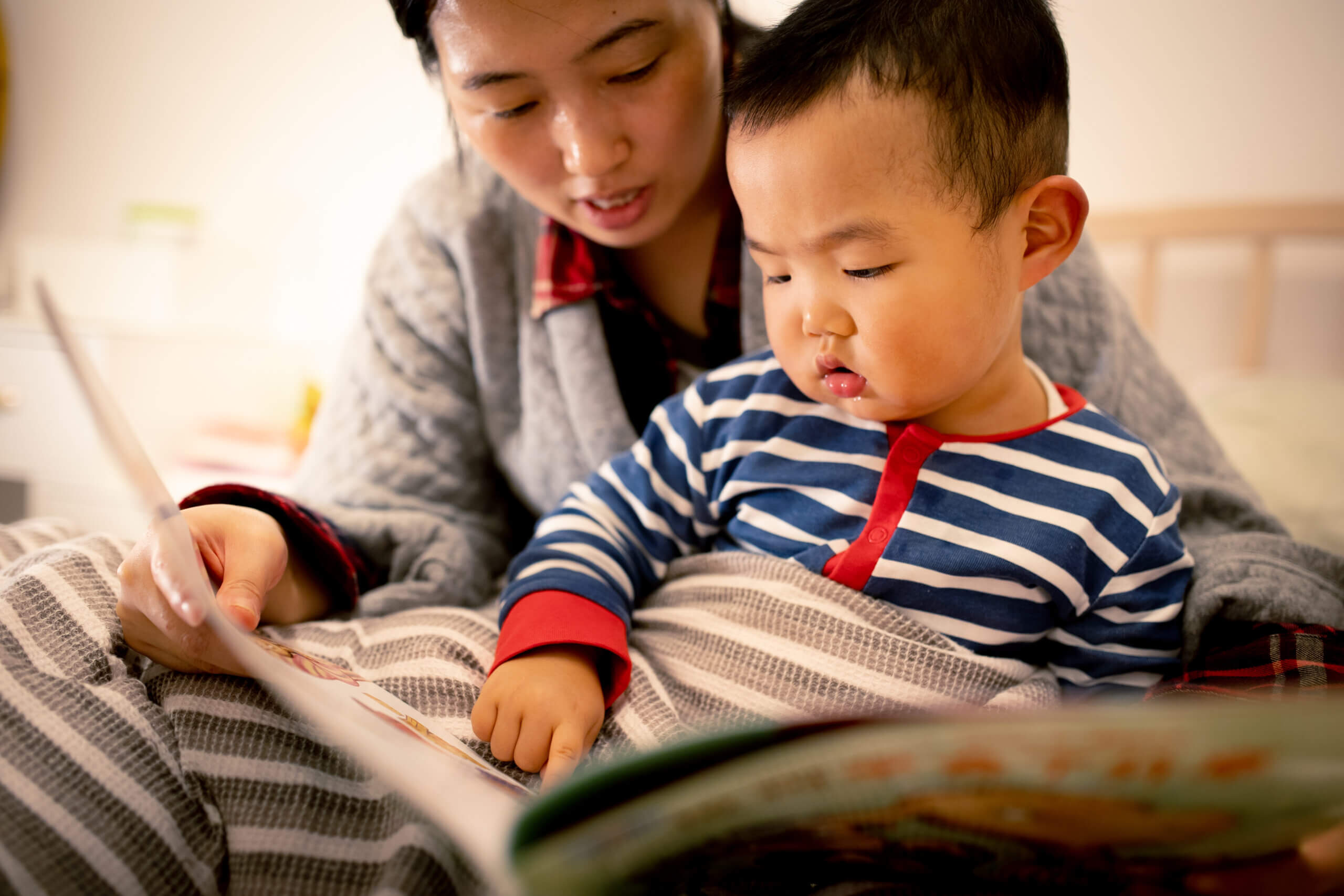 Woman reading to toddler