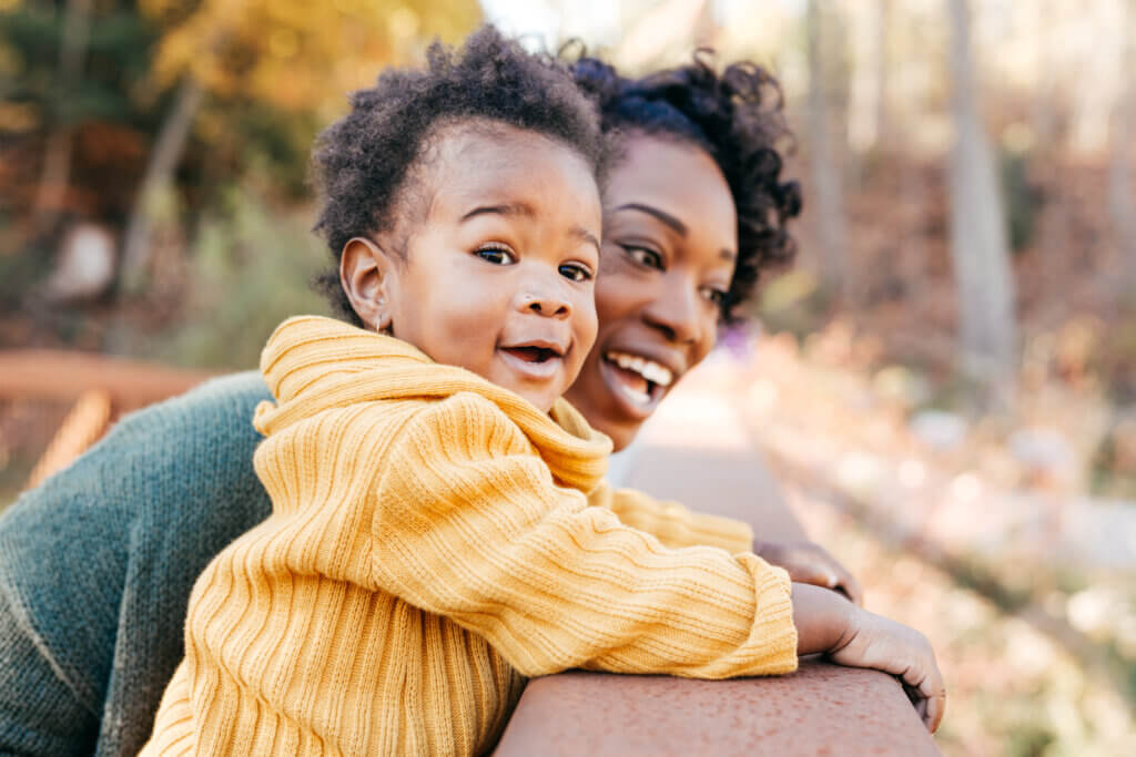 Woman and child having fun at a park.