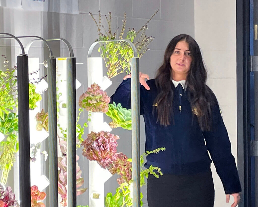 Student & FFA member Autumn Clavin explains the Grow Towers that will be located at WCA elementary buildings. This unique piece of the fourth-grade curriculum introduces agriculture and food systems.The towers have the technology to allow Mr. Sawatzke to monitor the plant health virtually so that teachers can focus on their classroom instruction, and he can assist to maximize production of the plants. 