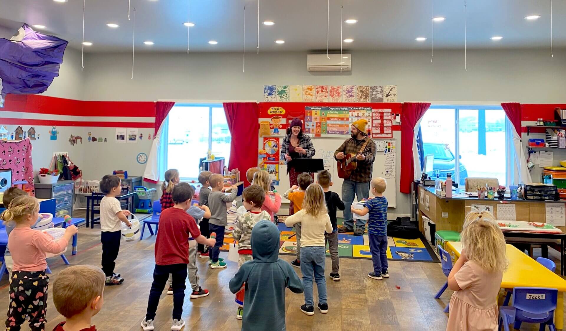 Kids dancing with musicians