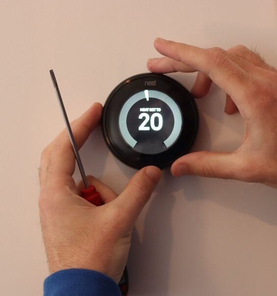 smart thermostat being installed.
