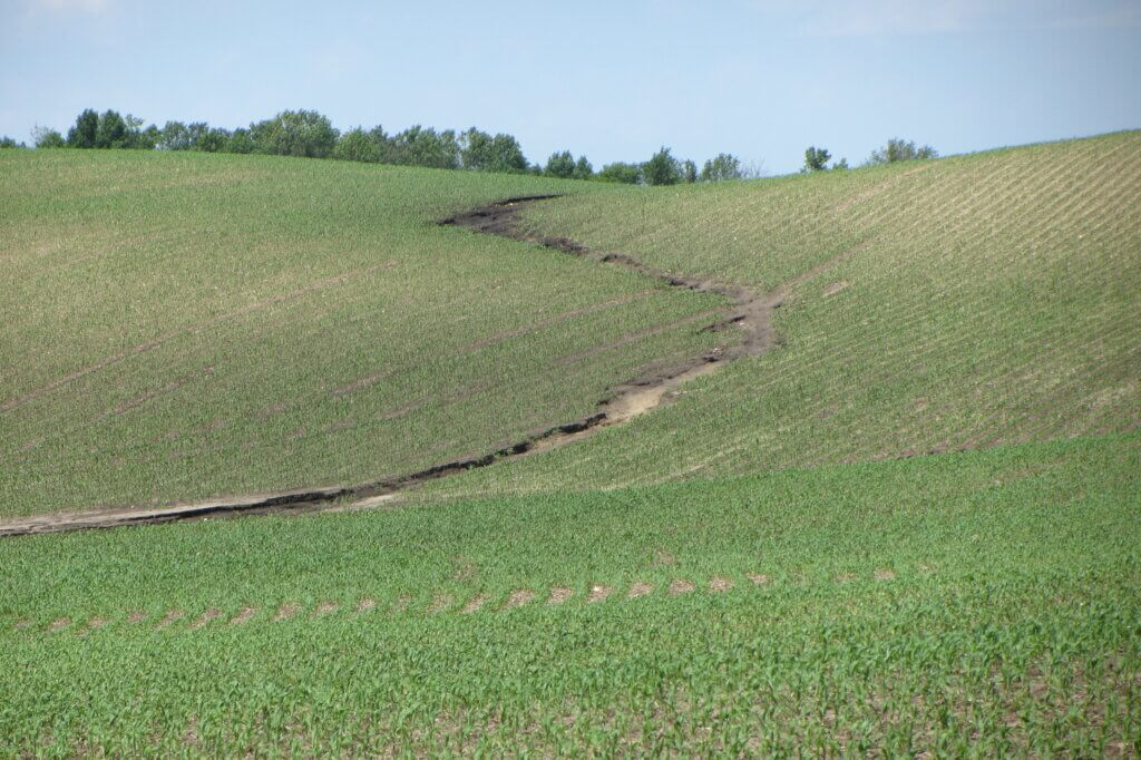 trench in field caused by erosion