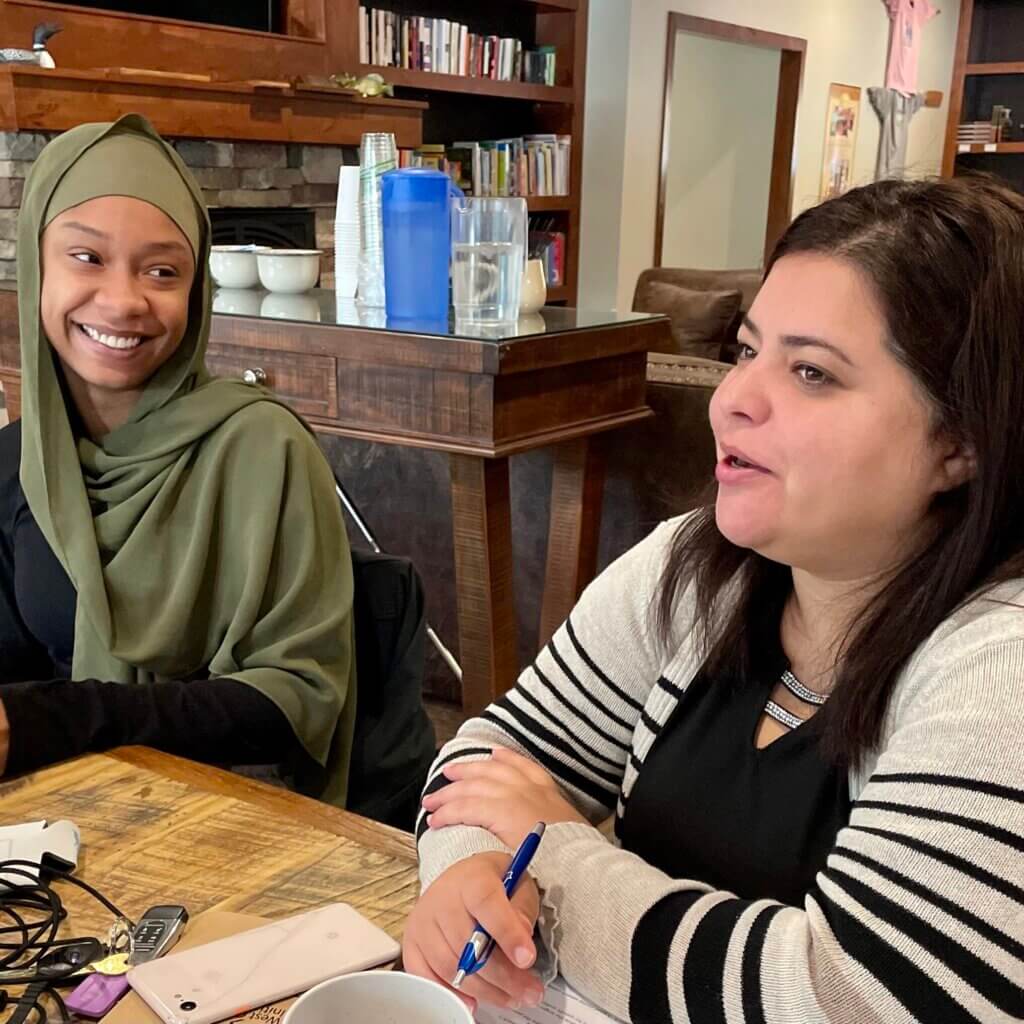 Two women talking.
