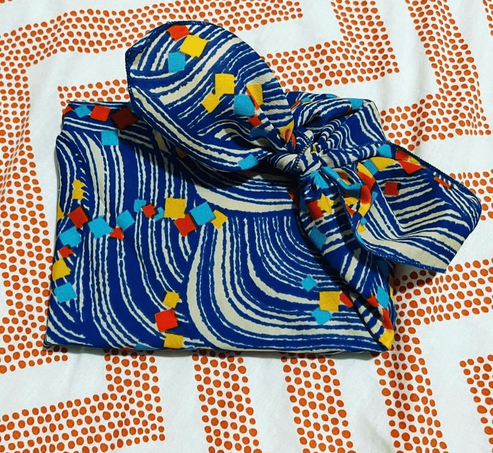 a gift wrapped with a scarf