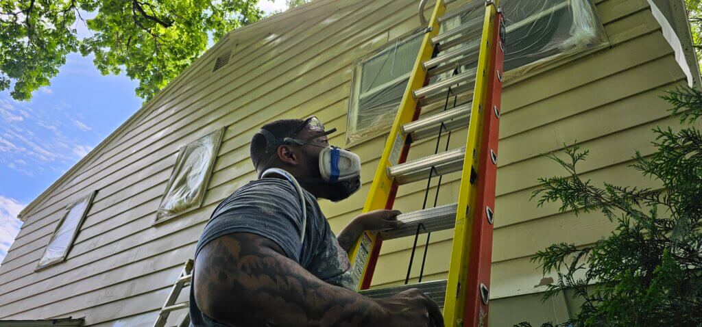 Big Boys Painting owner Don Martin painting.