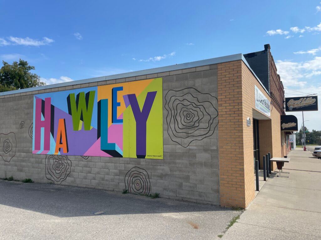 Artists on Main Street mural in Hawley.