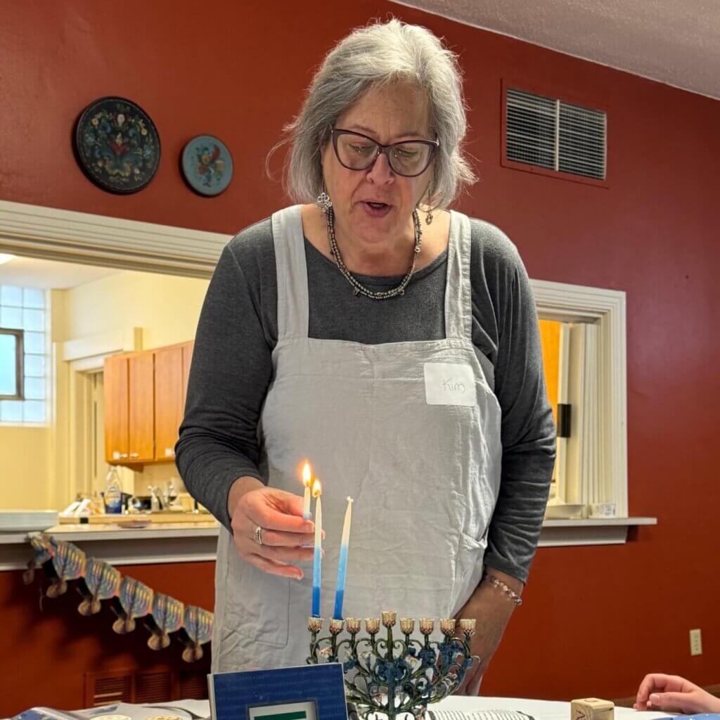 Kim lighting menorah.