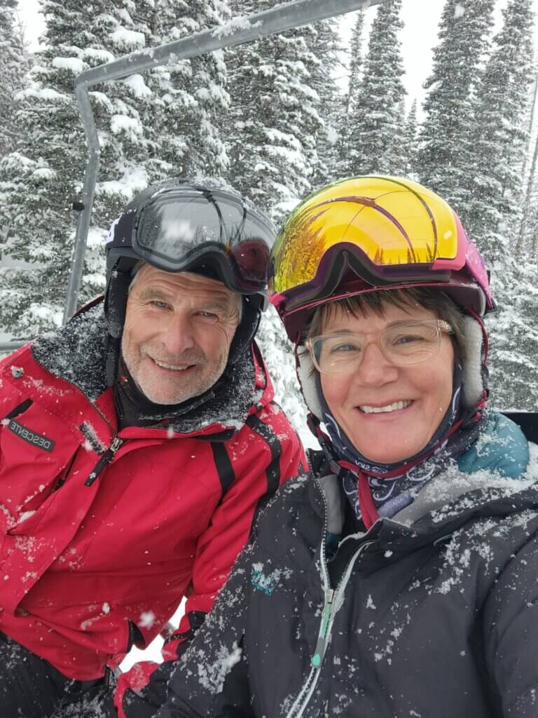 A close up of Dan and Lisa on a ski lift.